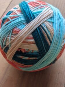 Biscotte 1 SKEIN (in self-striping colorway) - shown in Oasis wound so that each color is in a winding